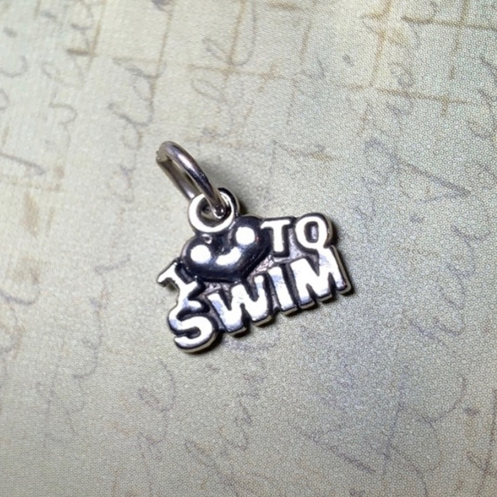 Adorable sterling silver swim charm!